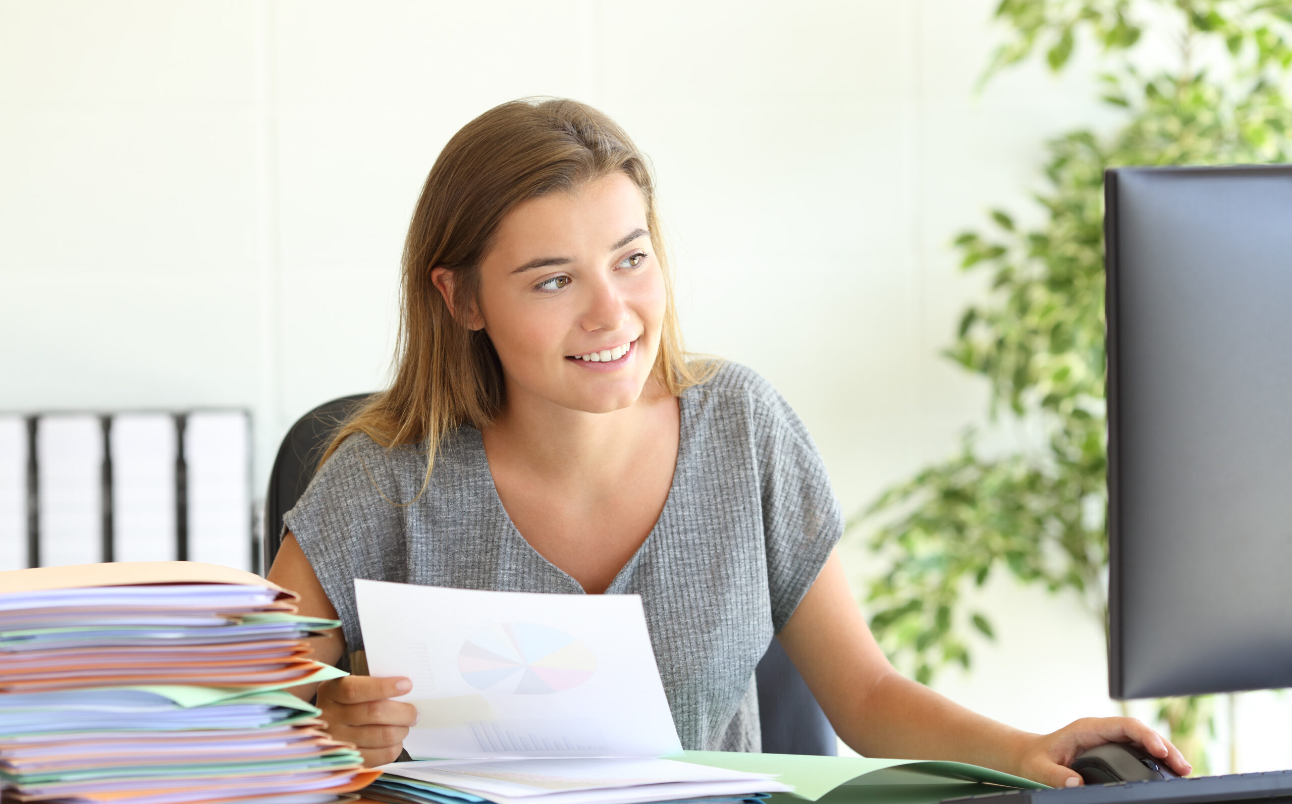Employee comparing report online at office